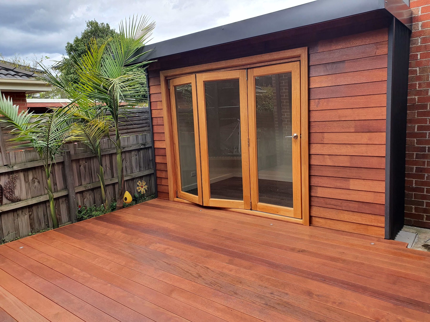 Melbourne Home Makeover timber deck with glazed timber doors and timber wall cladding