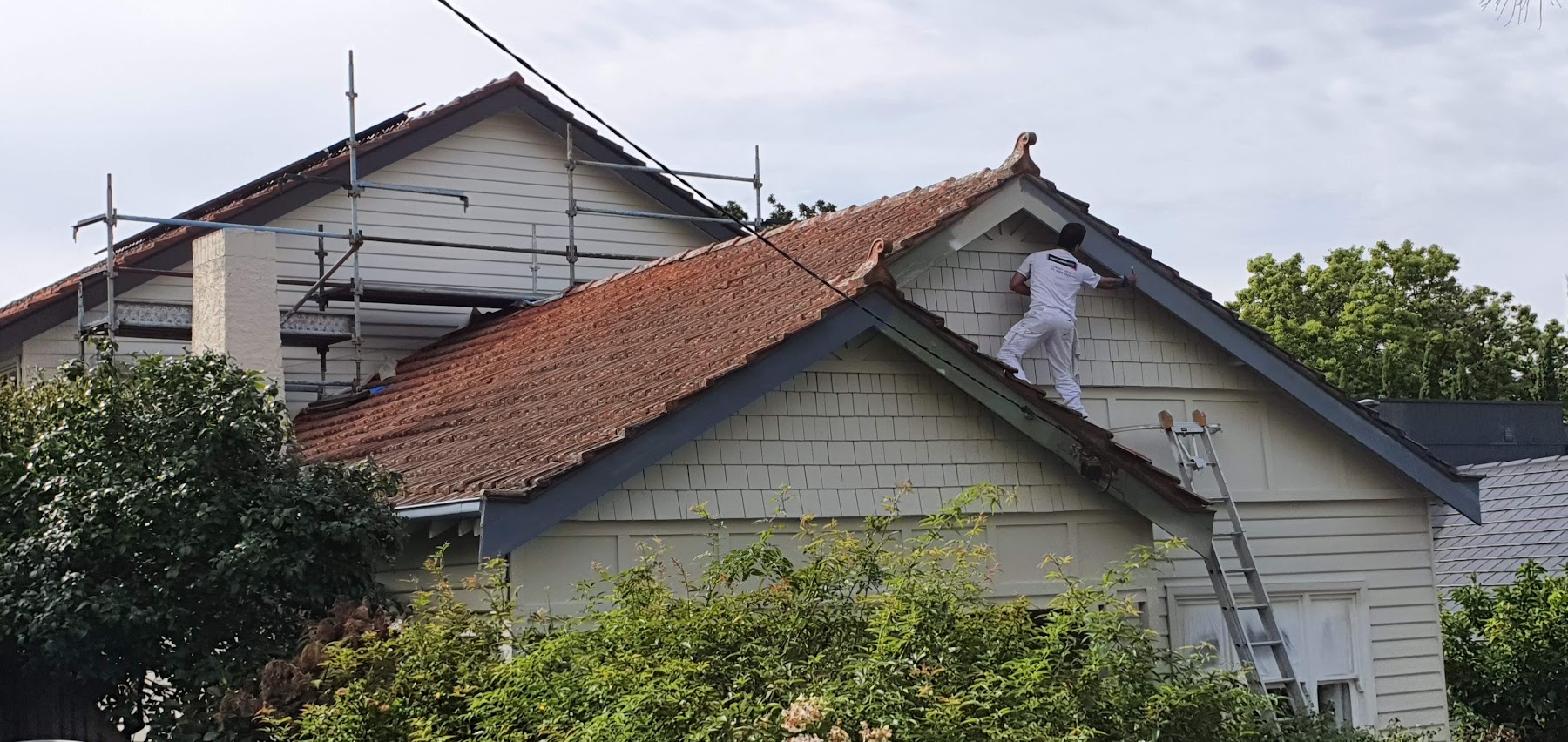 Exterior painting in progress on a weatherboard home, from Melbourne Home Makeover's owner gallery